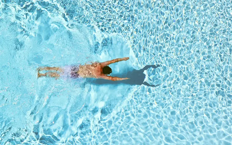 person swimming in pool